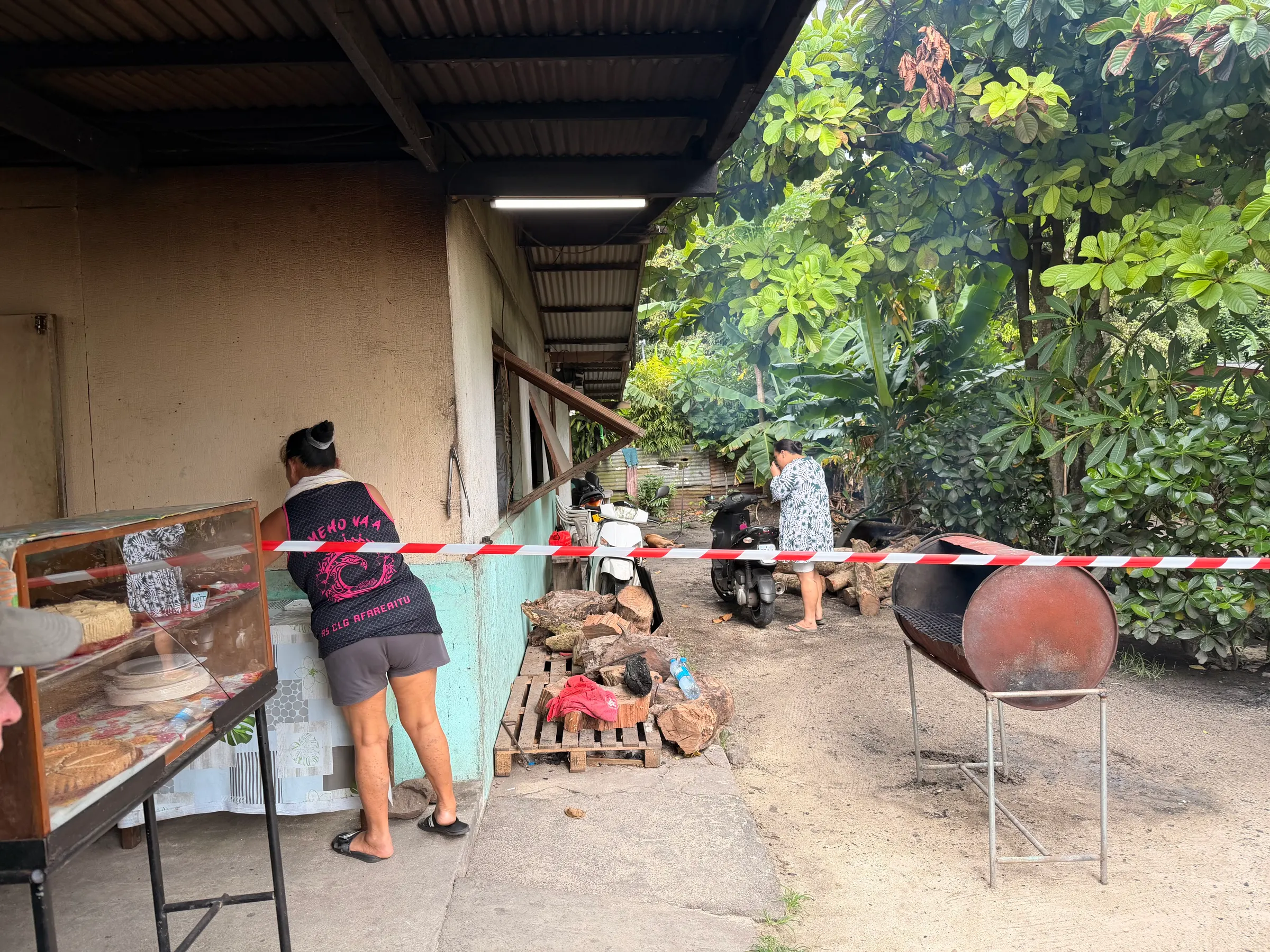 Our BBQ place. You can see the BBQ barrel where our meat was cooked. To the left is a case where they sale homemade cakes and stuff. I doubt they have a food inspection in these places. But they seem to be quite healthy!