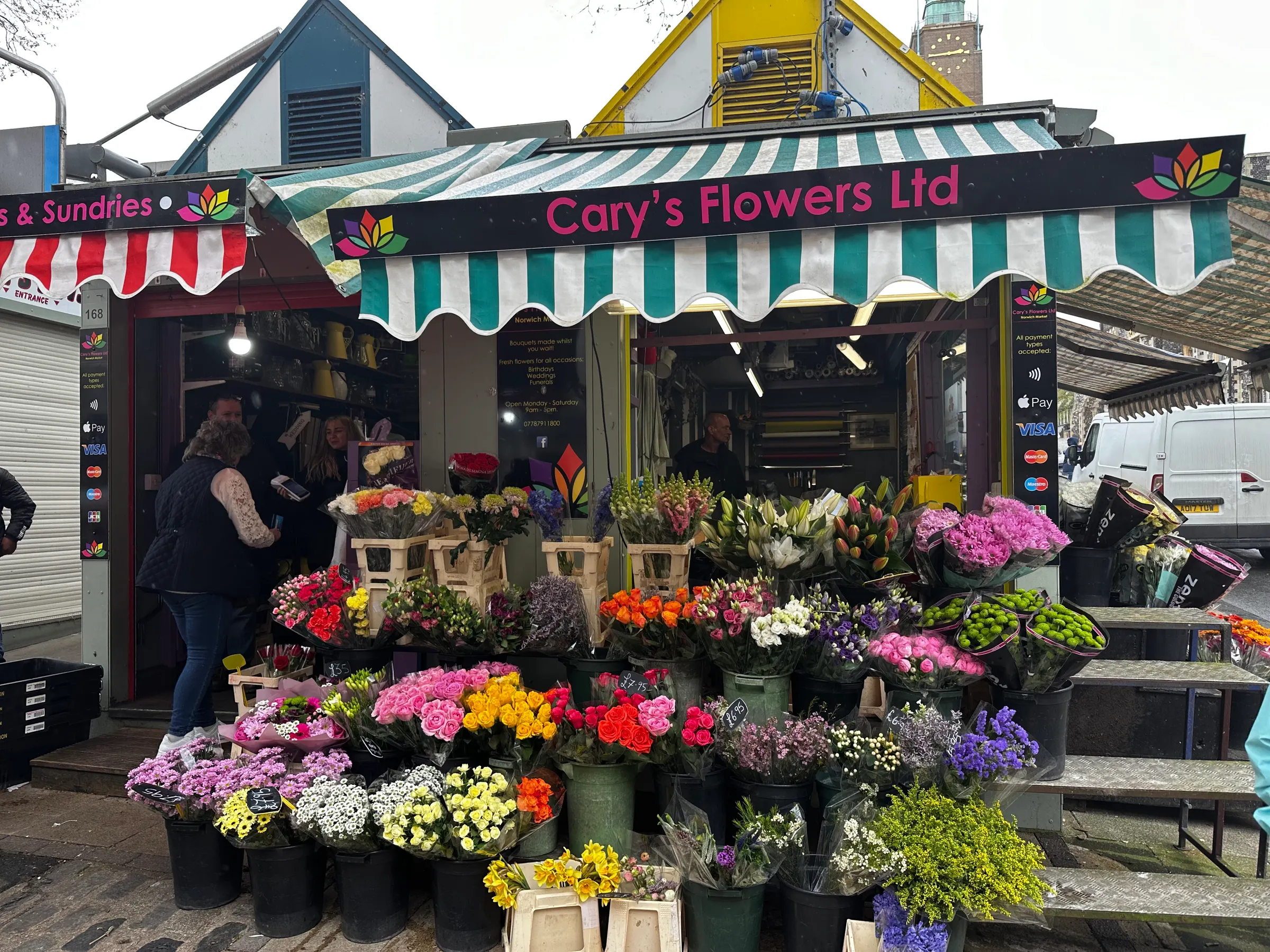 A flower shop at one of the booths at the Norwich Market. This market is open most days all year round.