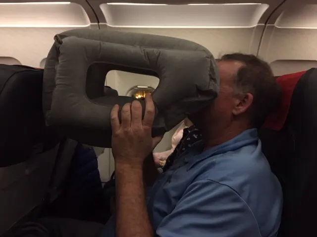 Me watching movies on the flight. No just kidding. This is pillow thing that Ashley bought us for trying to sleep on the plane. I was so tired that this could have been a big rock.