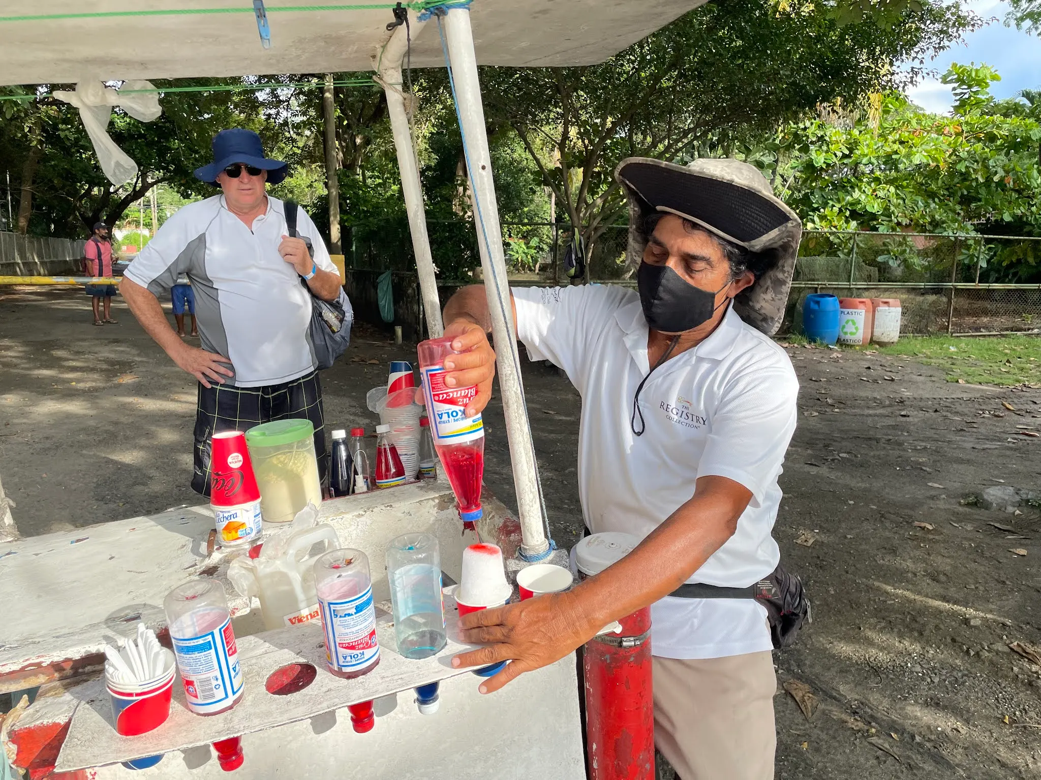 Denise had read a bit about things to get when in Costa Rica. One of those things is a Churchill or its smaller cousin, a Copo. Turns out this guy was selling Copo’s on the beach. His name was Mario. He made Denise a cherry Copo. It is basically a layer of shaved ice, powdered milk, more shaved ice, and sweet and condensed milk on top. It was a unique taste. It was pretty good.