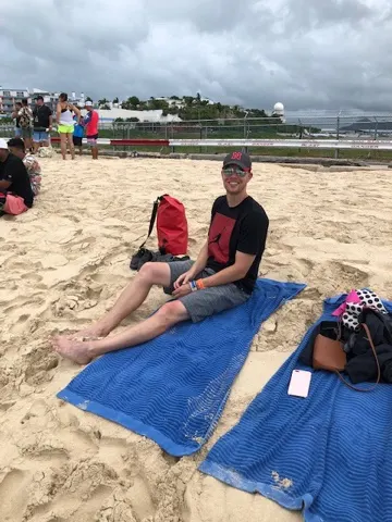 Brent chillin on the beach....you can see the end of the runway behind him.