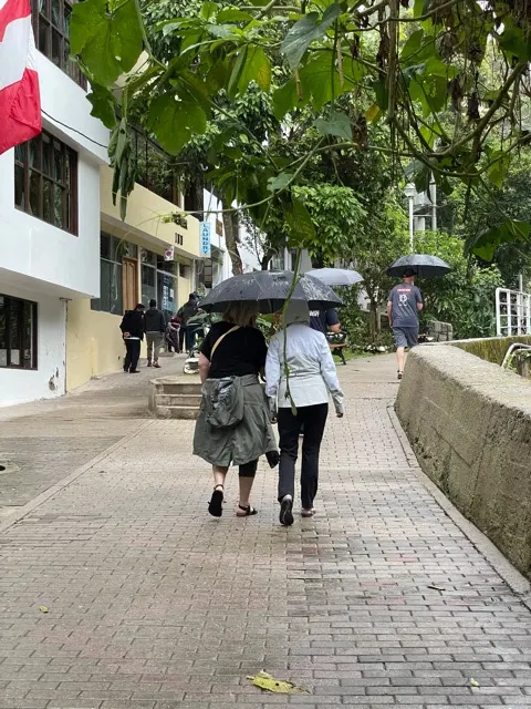 It rained quite hard in the afternoon today. So umbrellas were up and being used.