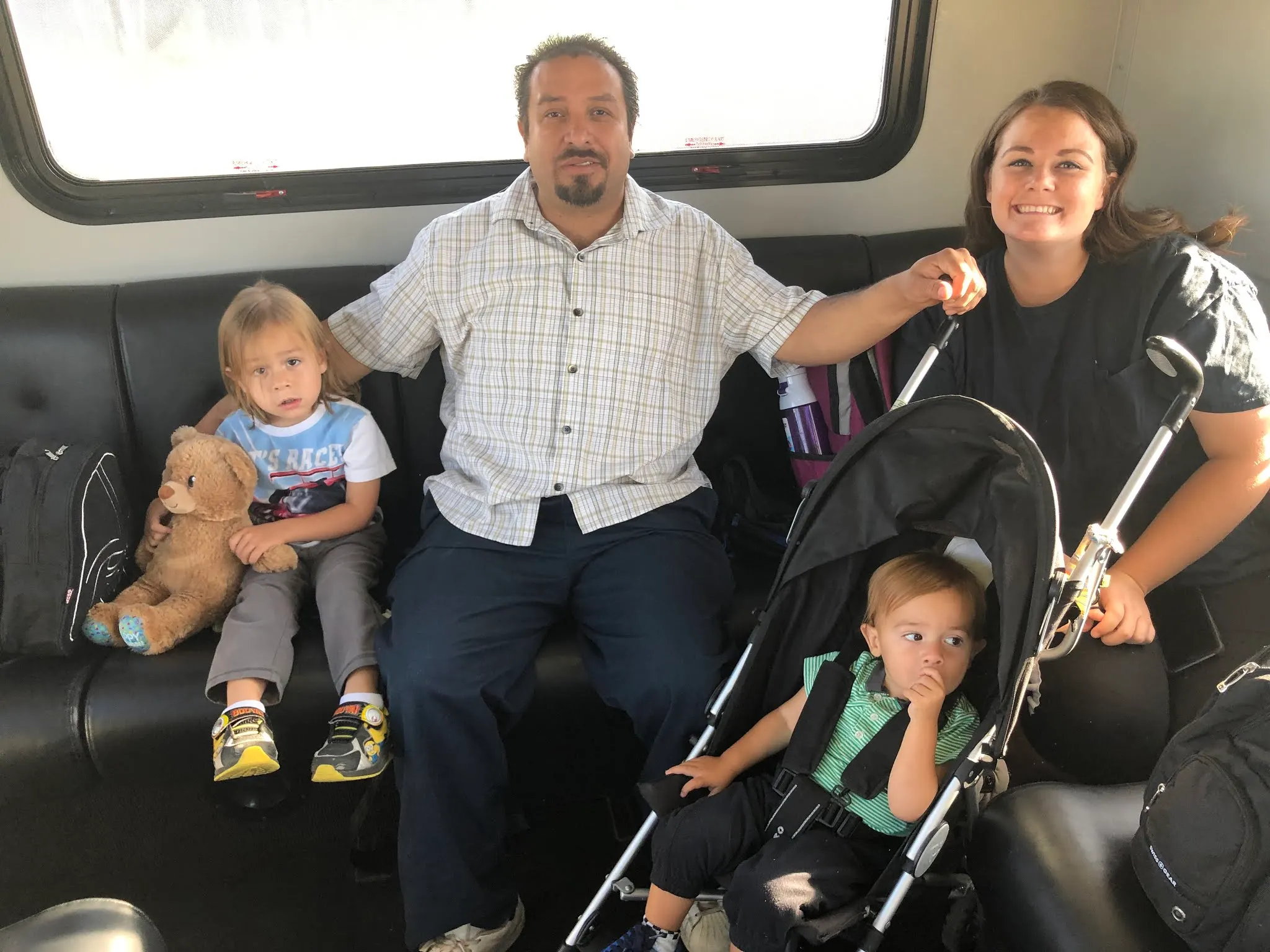 In the airport shuttle...Neza, Karlie and kids.