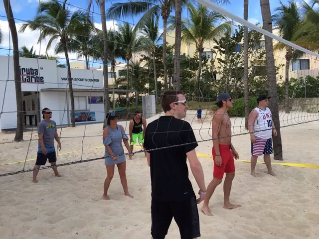 An intense volleyball game on the beach.....