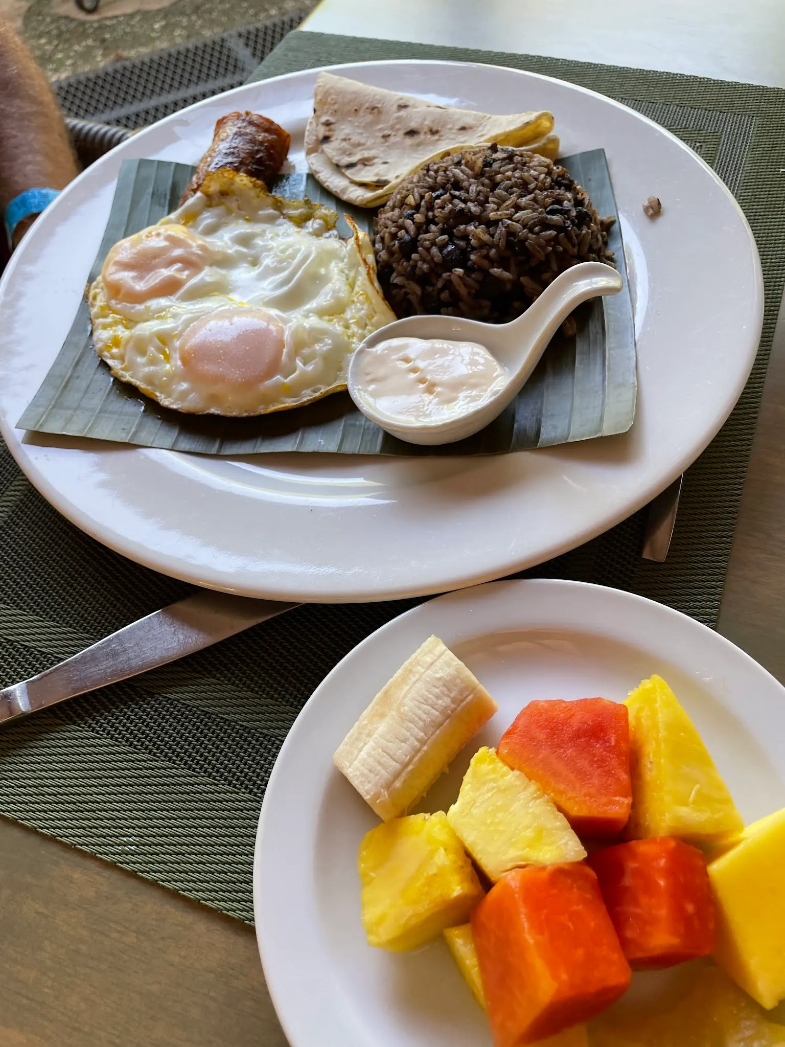 My standard Costa Rican breakfast. Platano, two eggs, rice and beans and tortillas with crema. And always a plate of fruit. I also had a glass of orange juice too.