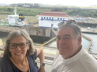 Miraflores Locks….the main station is behind us and you can see the locks behind us with high water in one (behind me) and low water (behind Denise). Eventually the low one rises while the high one lowers until they are equal. Then the boat passes. They do this twice.