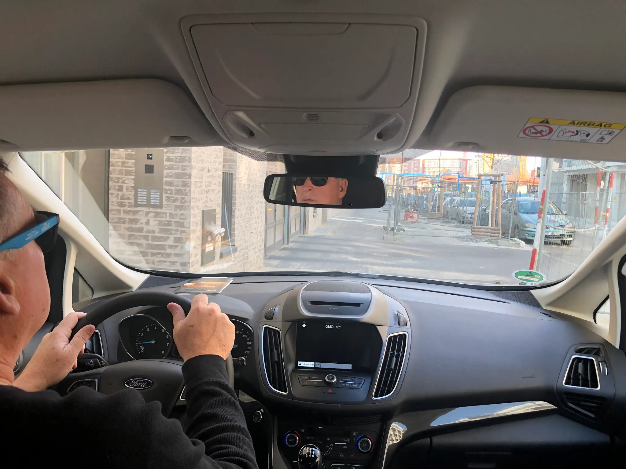 Leaving our apartment in Berlin. I illegally drove on a sidewalk to get round the building close to where our suiteases were.