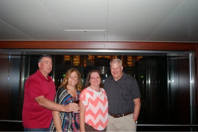 Funny story...we asked a lady coming down the stairs to take our picture. She said sure...and handed me her glass of wine. So we kept it in the picture....