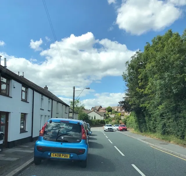The cars just park in the road...and then you get to dodge the cars coming at you as you pass the parked cars...