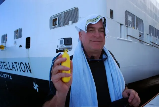 Me and my GoPro. As you approach your ship, they give you water or punch and hand you a towel that has been frozen in ice. Feels so nice after a hot day!