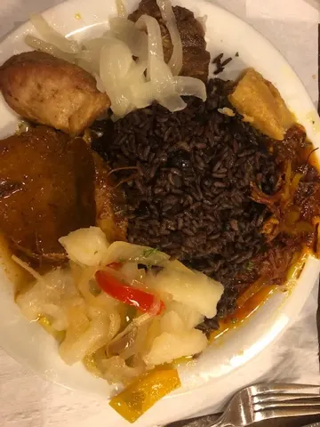 Some dinner...first picture is my plate...port roast with the pig skin left on it. I tried the skin...pretty chewy. But the roast, yummy! Denise's plate was a Cuban sampler. It was really good too.