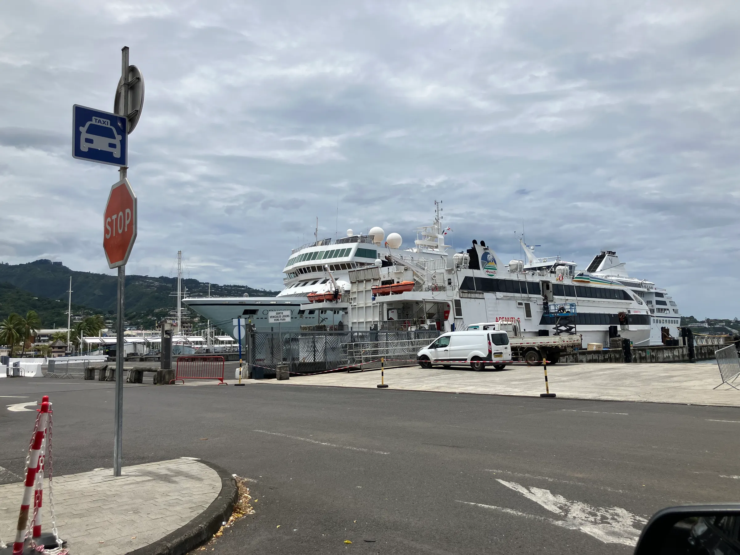 Sitting and waiting at the ferry terminal. You can see a cruise ship in the background. You also see the bigger ferry that goes a couple of times a day. We did not get on that one. Ours was a very large catamaran.