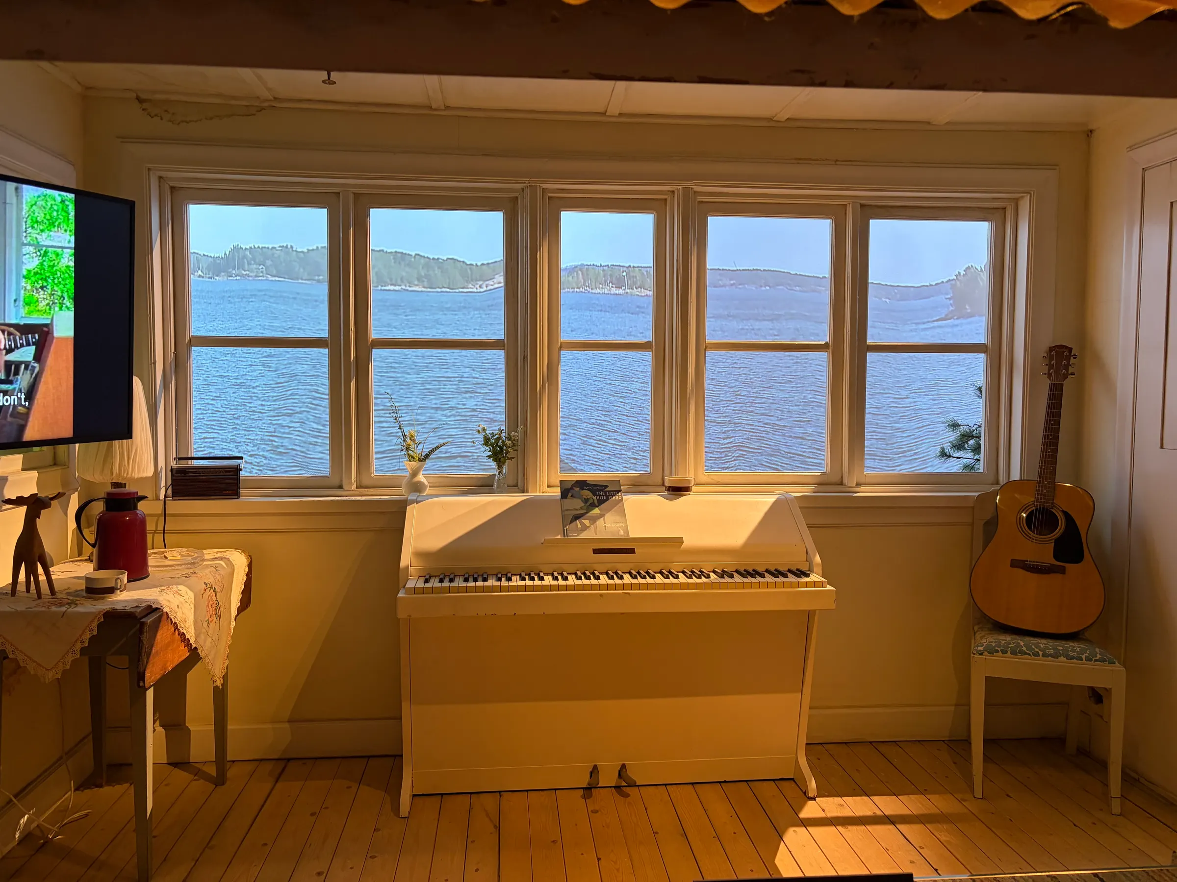 This is the old white piano that the men wrote their songs on. They bought a house looking over a lake and there they wrote a lot of their music.