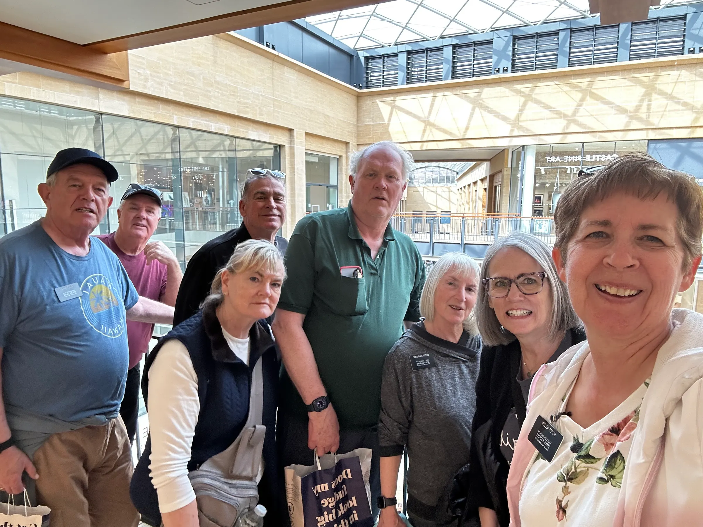 We are at the Grand Arcade Mall taking our last group photo before we head off to our flats at the temple.