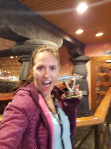 Ashley was given a 'ship on a stick' trophy for all the dancing that she did at the 90's trivia game show. So funny....