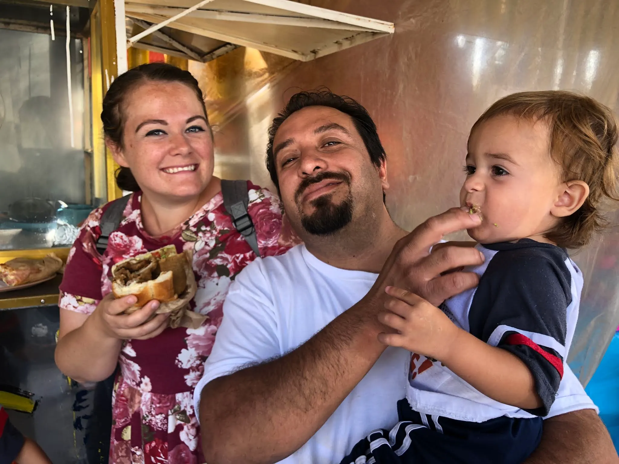 At the torta stand eating very large sandwiches...
