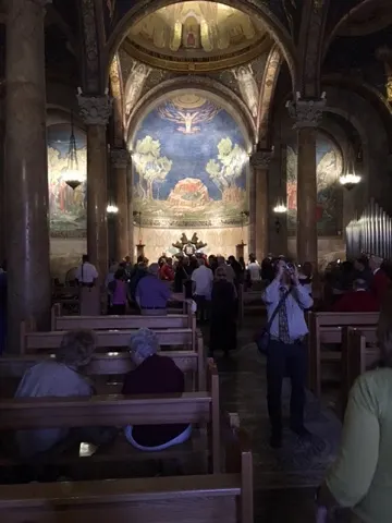 Inside the Church of the Agony. The mural depicts Christ in agony against a rock...