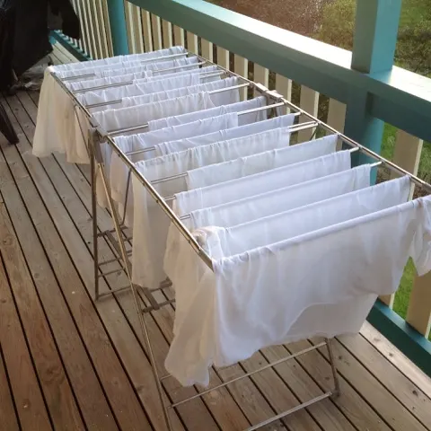 Laundry day at our the B&B....we had to pull this inside our bedroom as the wind kept blowing the clothes down. We'll see how well they dry.