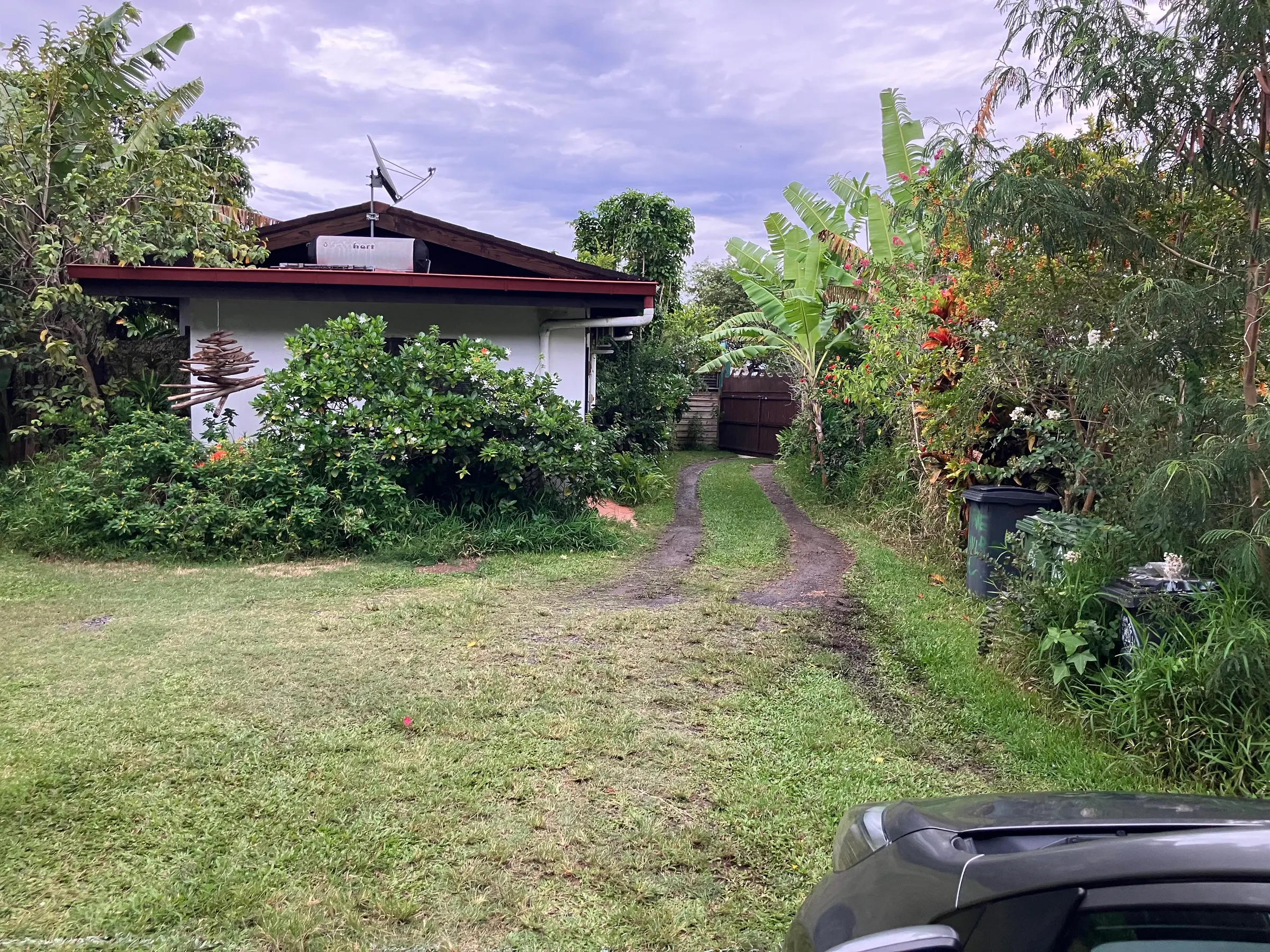 This is the driveway looking from my rental car. The building you see is the two bedroom flat that we are in.