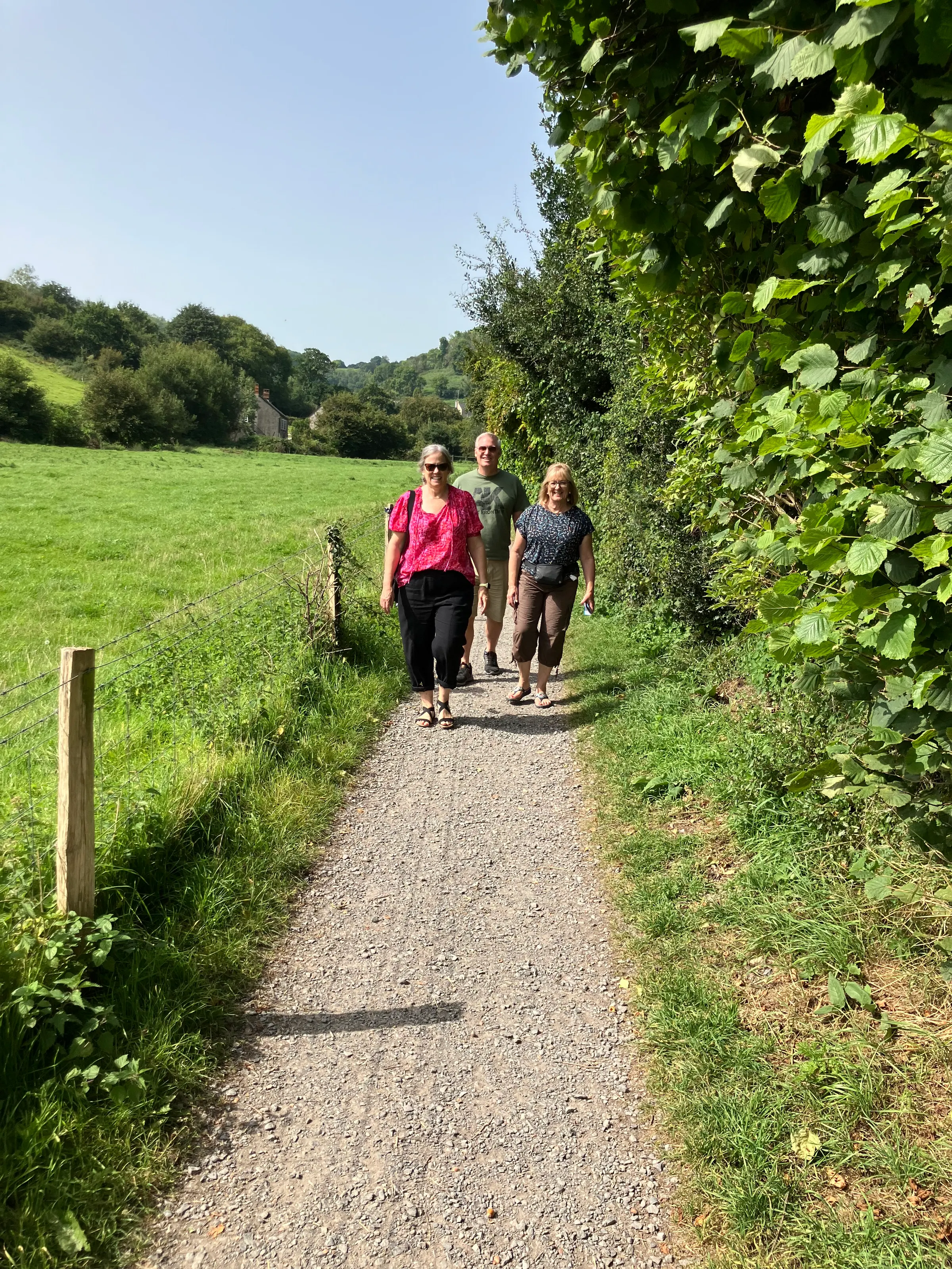 The group walking down the path to the beach at Branscombe.