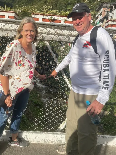 Placing our lock on the fence on the bridge. They will remember us forever! We have to come back now….or at least our kids do!