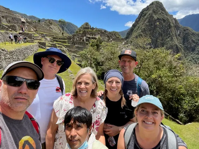 Nice picture of the group with MP behind us. So green and lush. Bugs were not bad although we did use some bug spray.