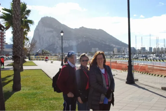 Kelly, Zella and Denise in Spain with Gibraltar behind them.