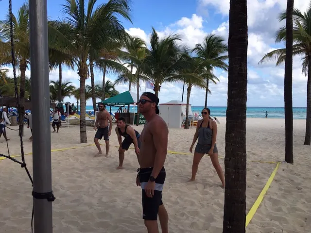 An intense volleyball game on the beach.....