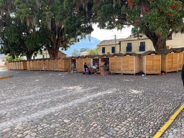 This picture shows the little tiendas, most closed, that were in the square. We were there pretty early. But a few were starting to open up.. It was a nice, little square.