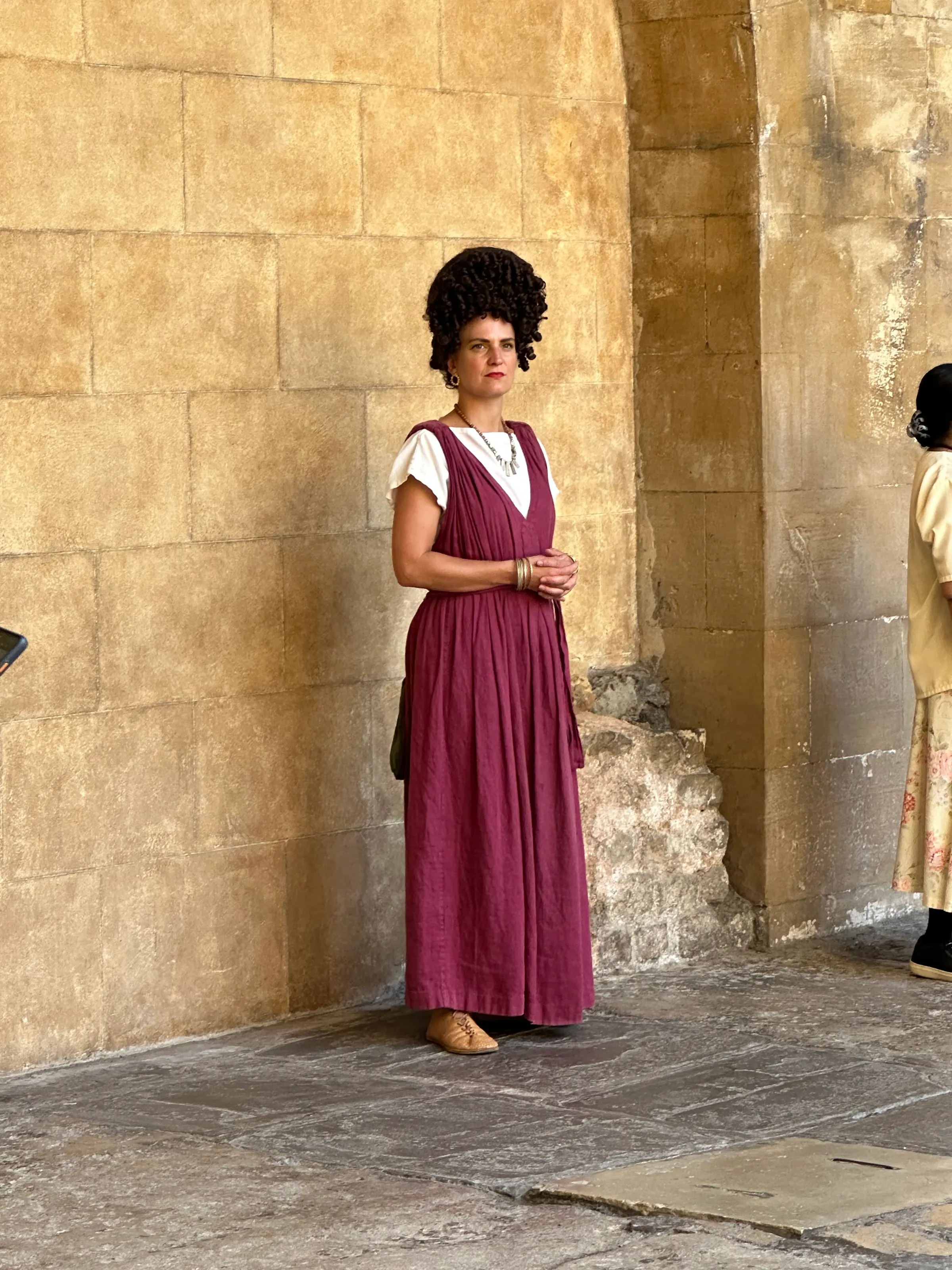 A lady all dressed in period dress.