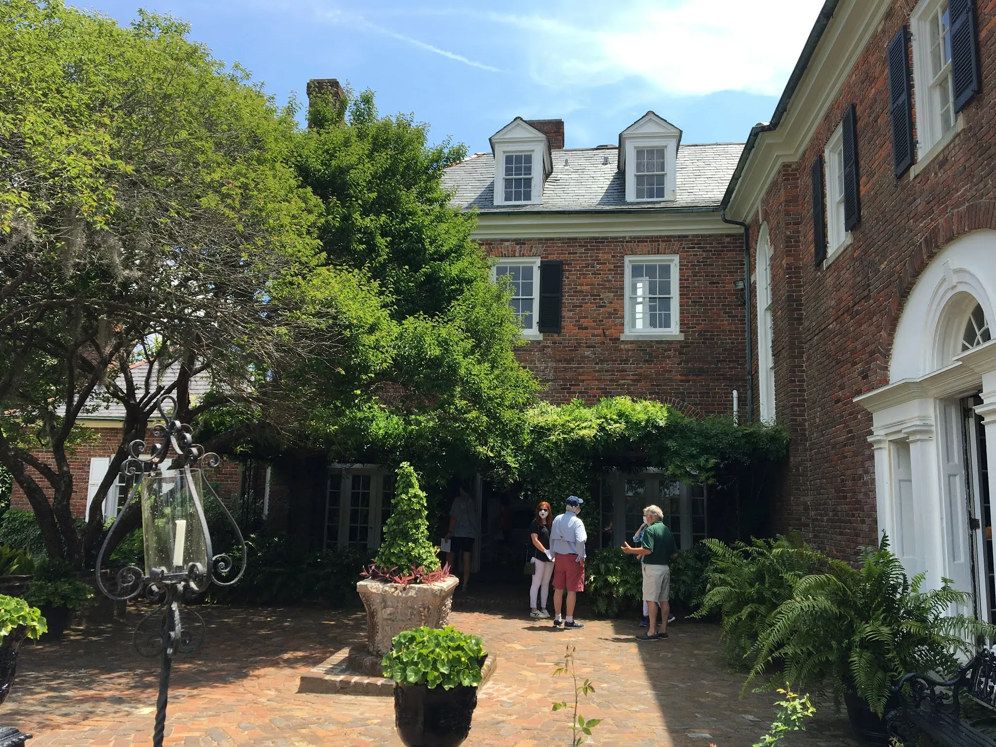 Road leading up to the mansion lined with live oak trees.