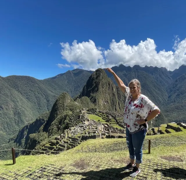 Denise touching the top of the little mountain. You can climb to the top of this mountain but it is very steep and at parts your have to crawl…so our guide said. People die on this trek!