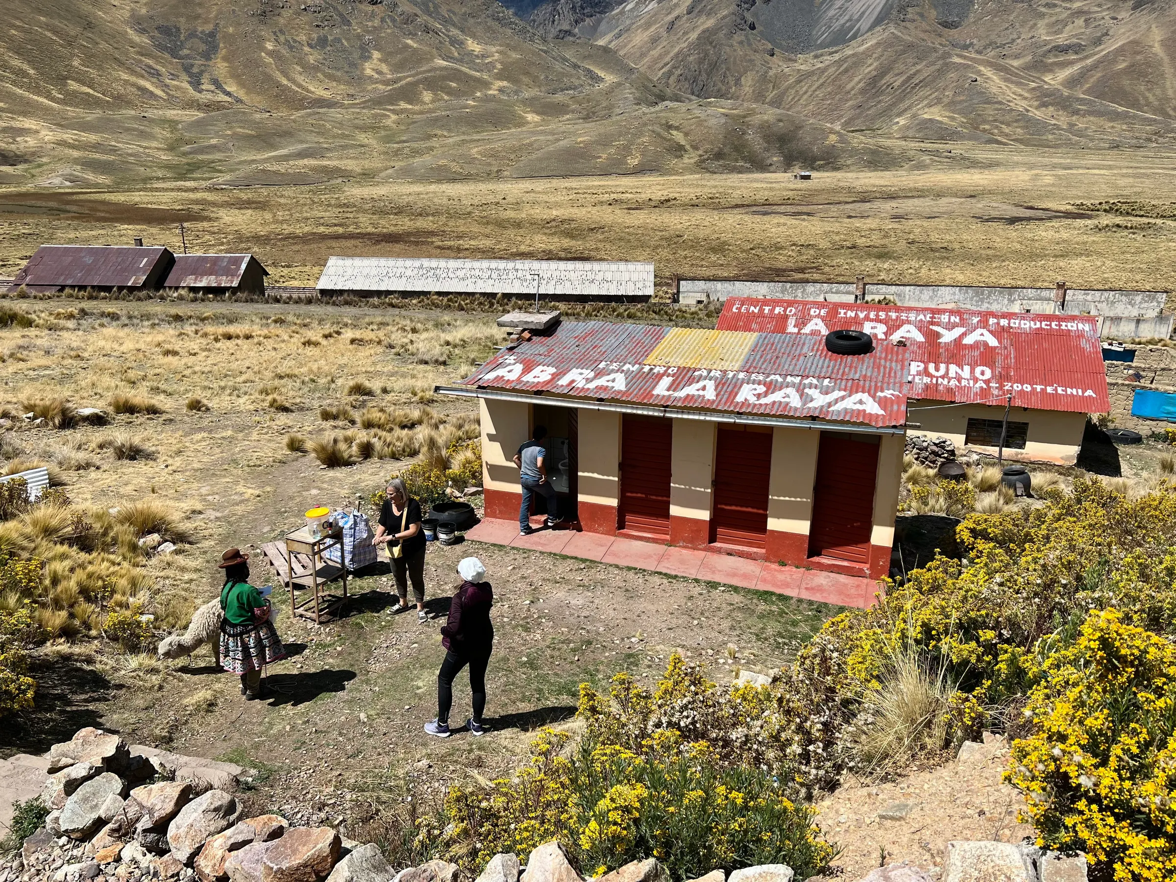 This was at a stop just prior to the construction. It is the highest point….14k feet…that we will go to. The girls are heading down to the bathroom.