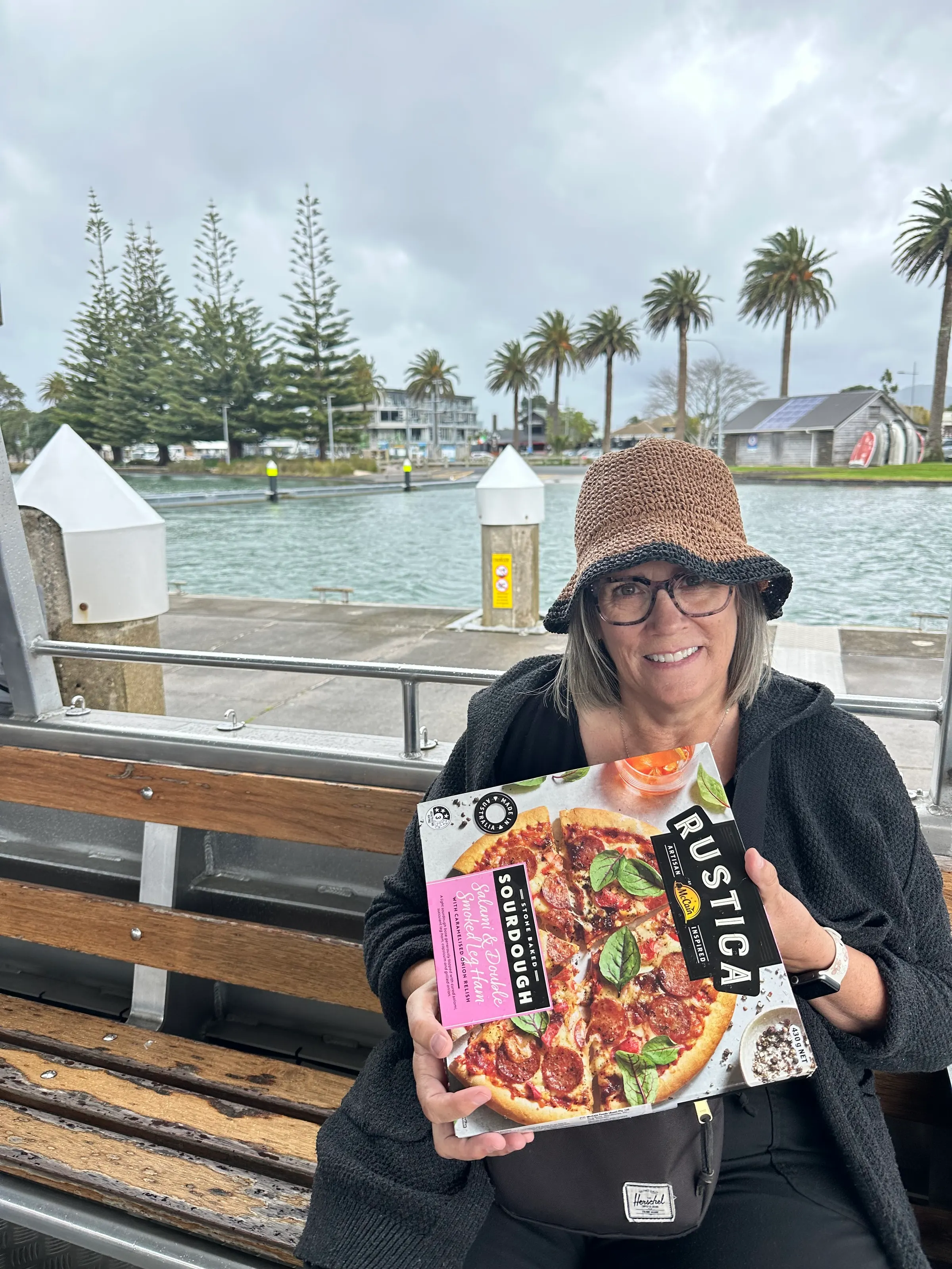 The bag lady with her frozen pizza that was melting in the rain while waiting for the ferry to come back over.