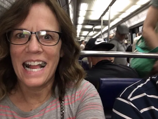 Either excited to be on the metro in Paris or just plain crazy....not sure which.